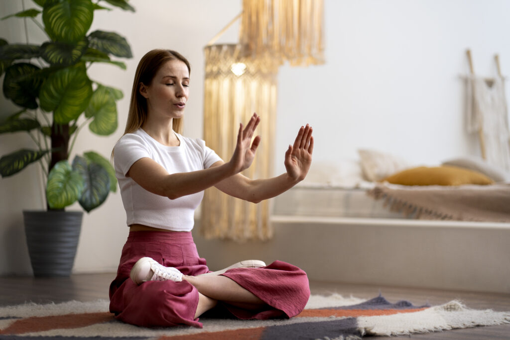 person practicing tai chi indoors